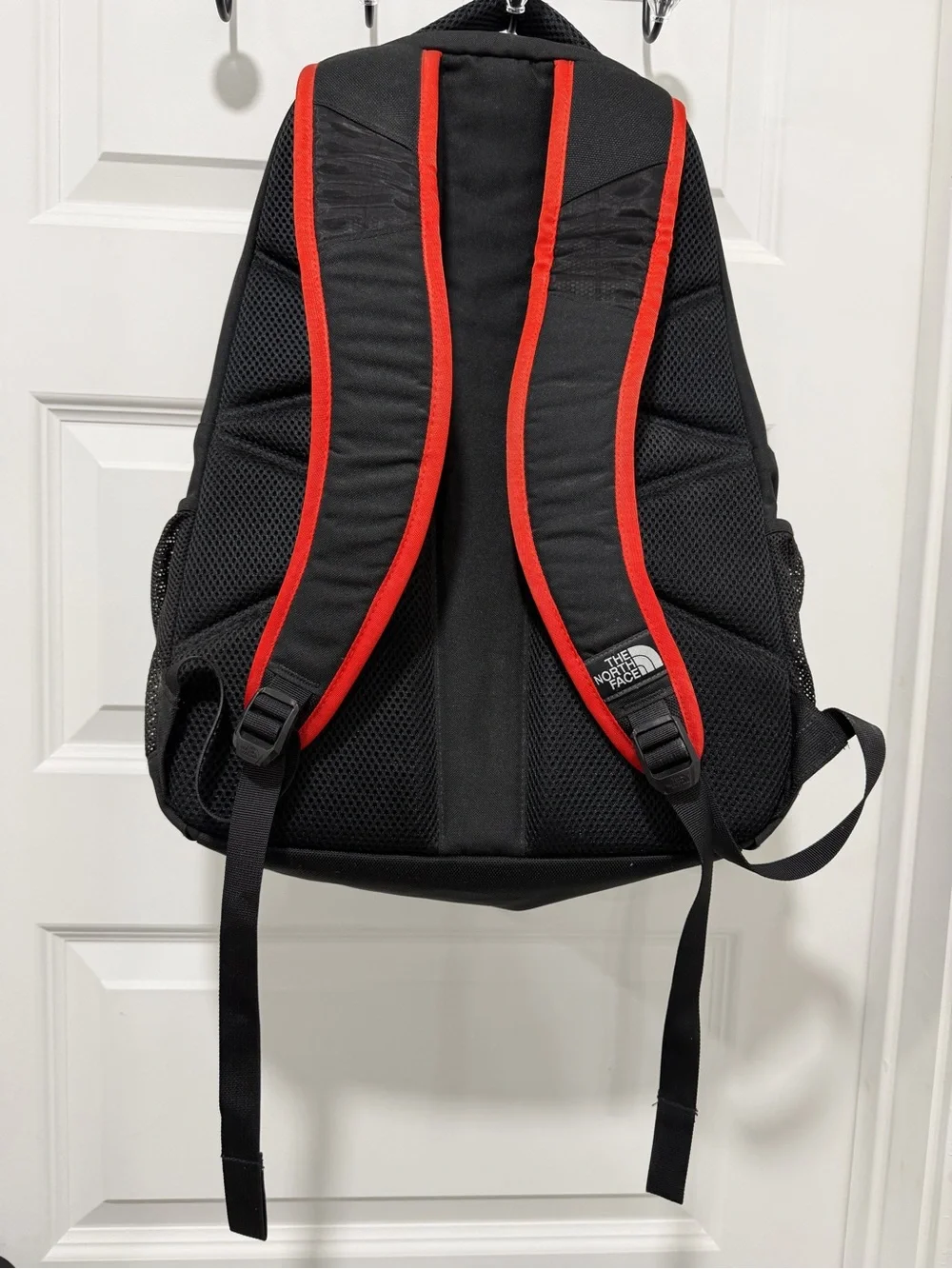 The North Face Haystack Backpack Vertical logo Black and Red